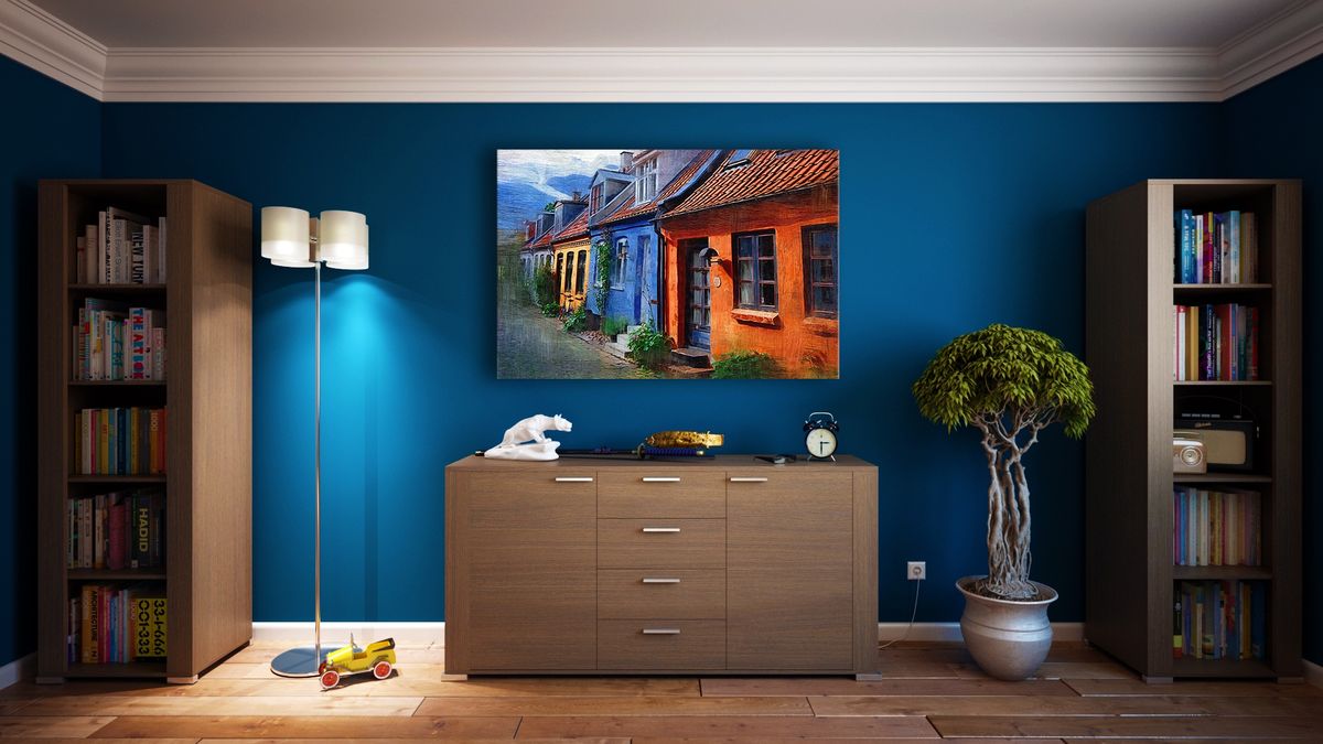 Boutique interior with a deep blue feature wall and considered styling